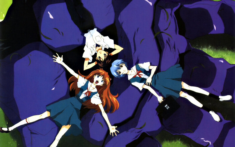 three students lying on ground