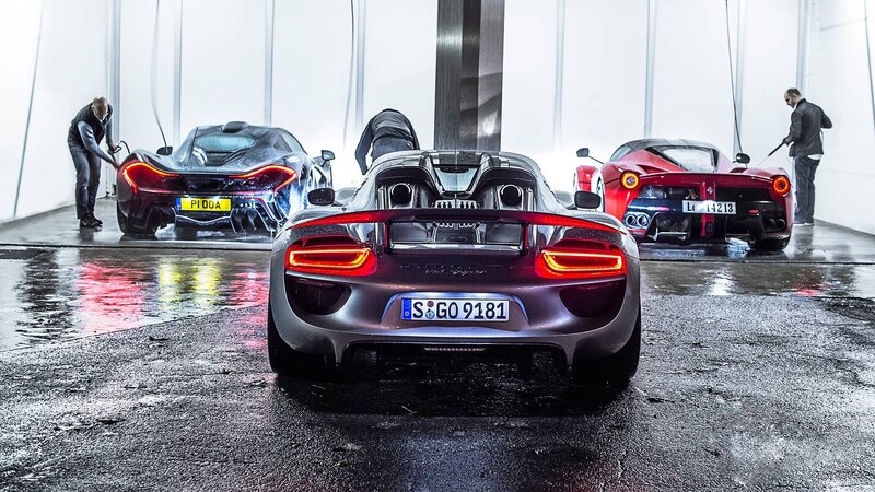 Three Supercars Being Washed