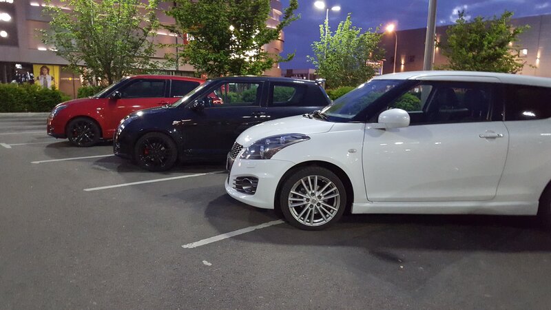 Three Suzuki Swift Cars