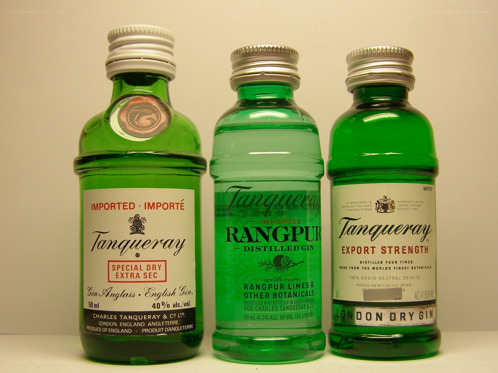 Three Tanqueray gin bottles