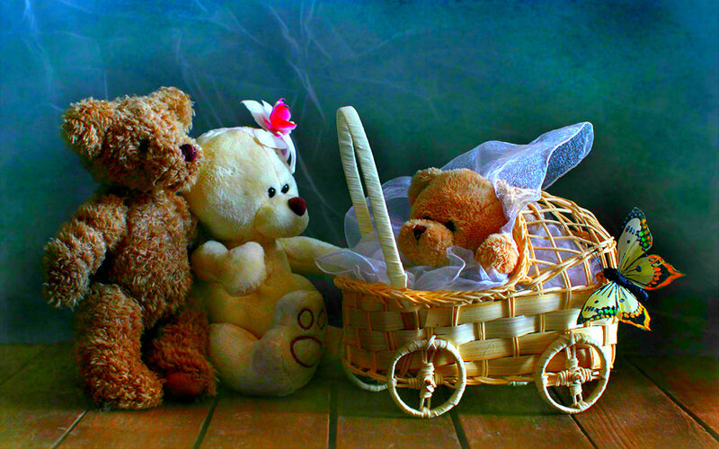 Three Teddy Bears in Basket