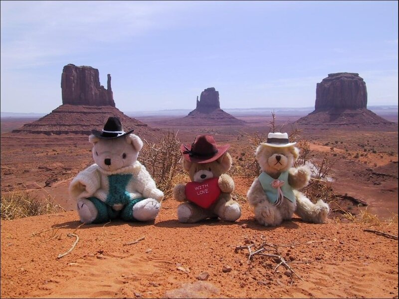 Three Teddy Bears in Desert