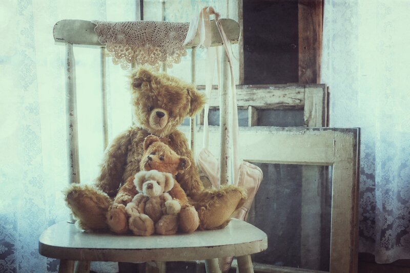 Three Teddy Bears on Chair