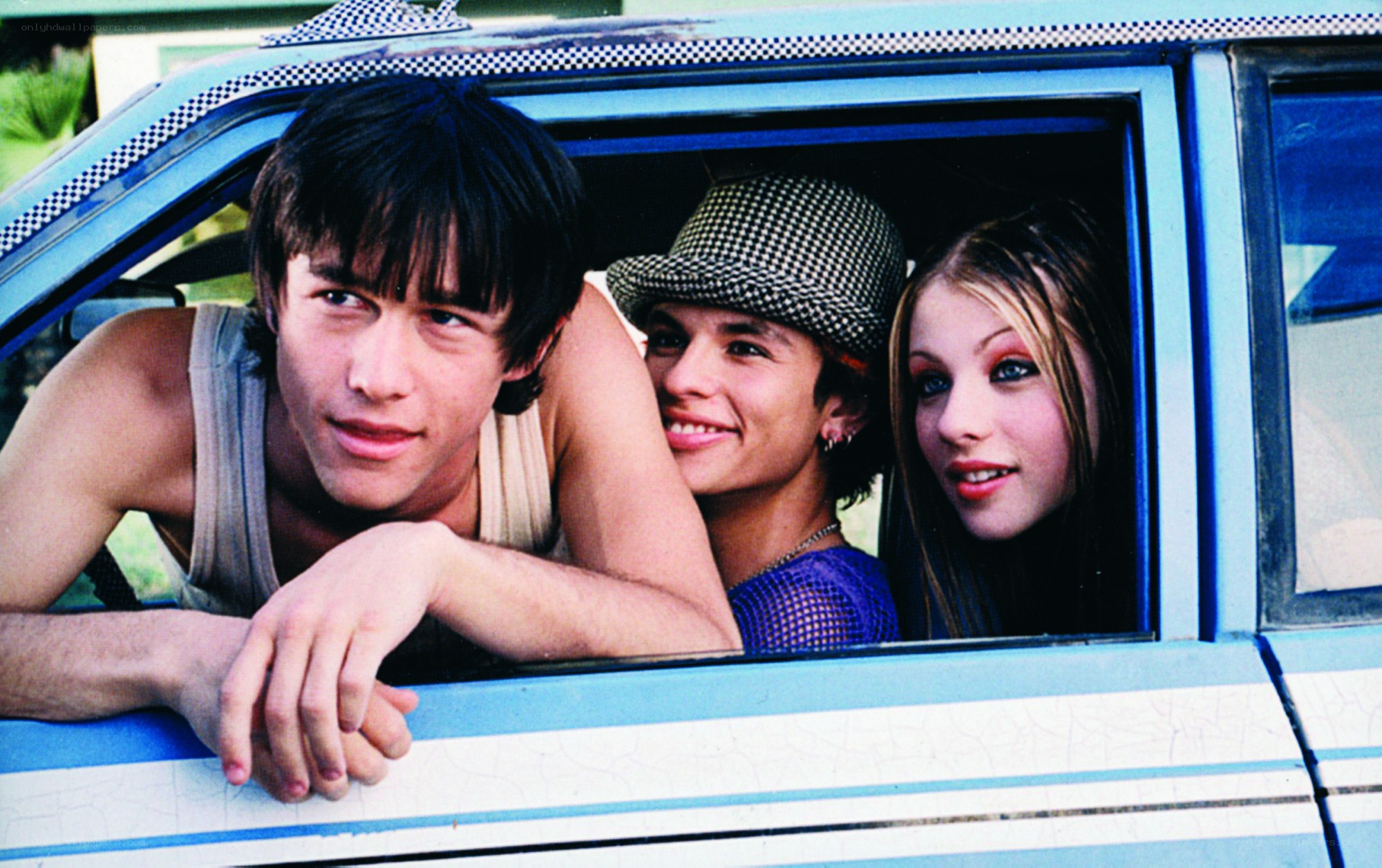 three teens in a car