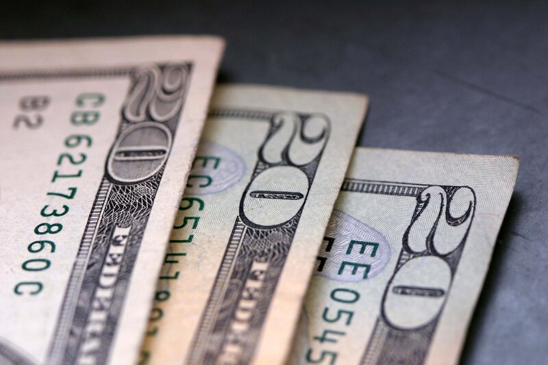three ten-dollar bills