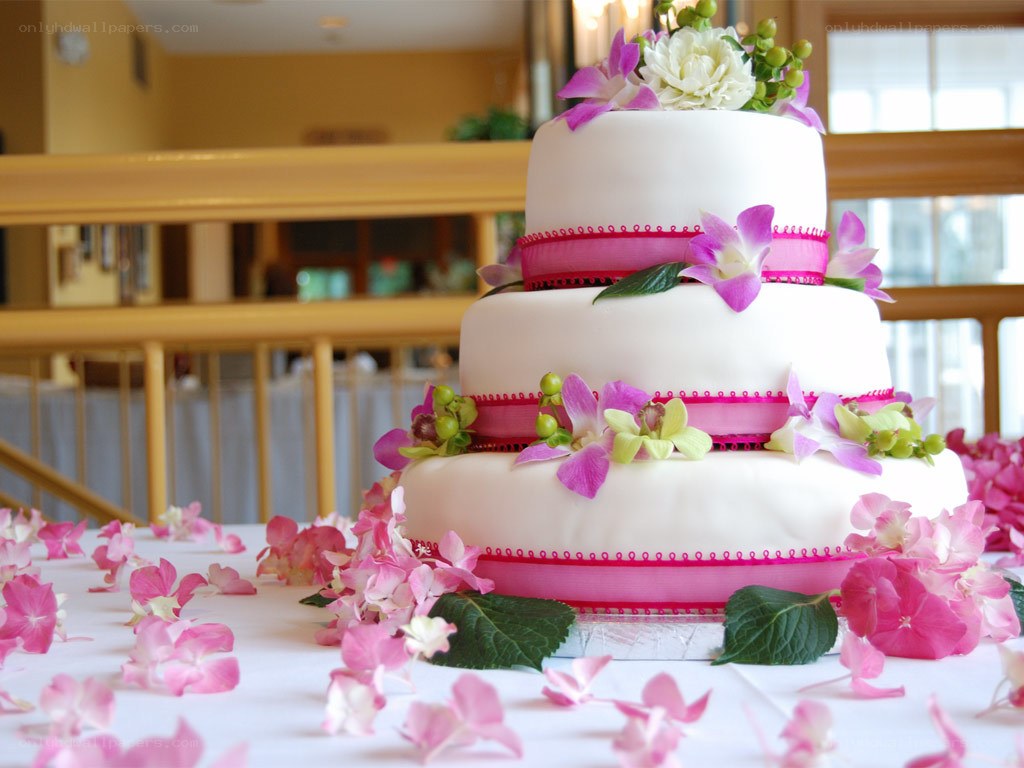 Three-tiered wedding cake with flowers