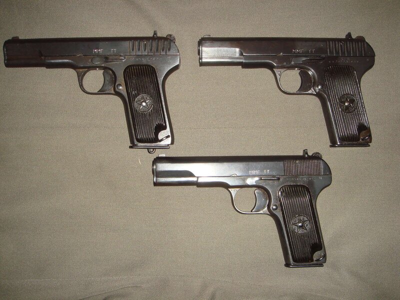 Three TT pistols on fabric