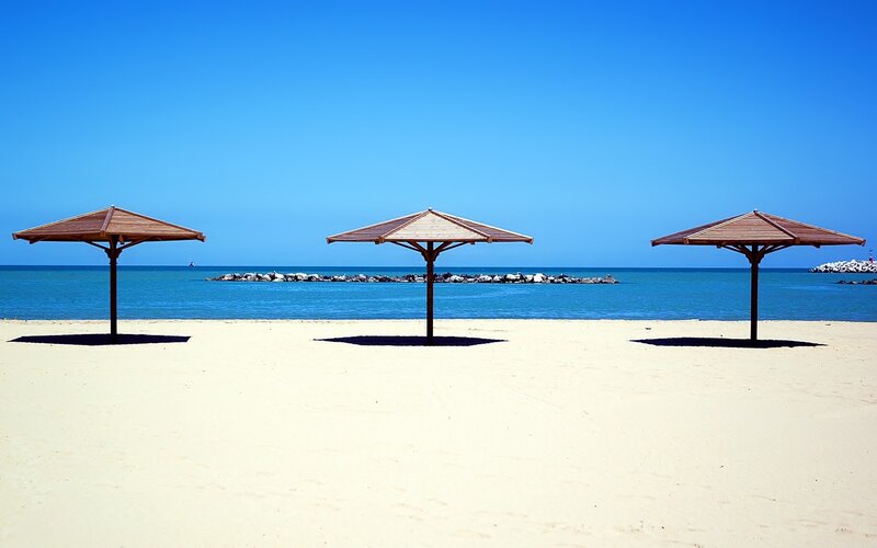 Three Umbrellas on Beach
