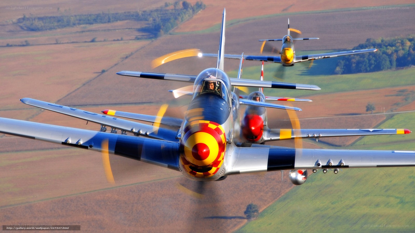 Three vintage fighter planes in formation