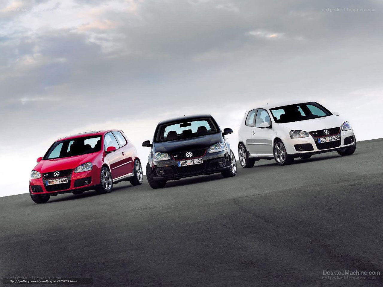 Three Volkswagen GTI cars on a road