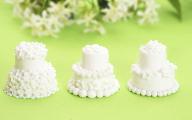 Three White Cake Figurines