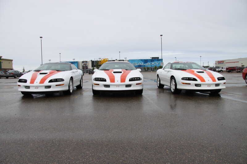Three White Corvettes