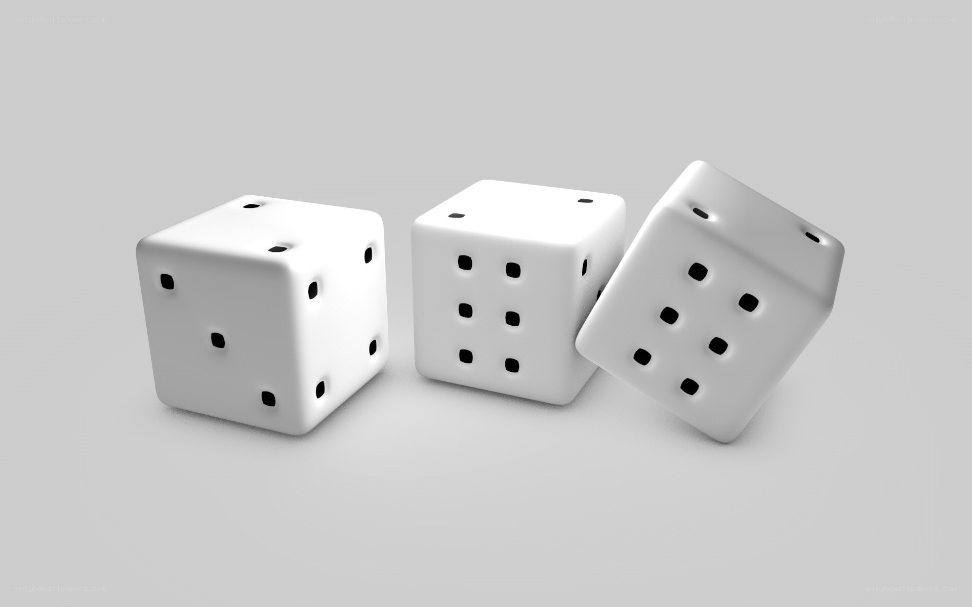three white dice on gray surface