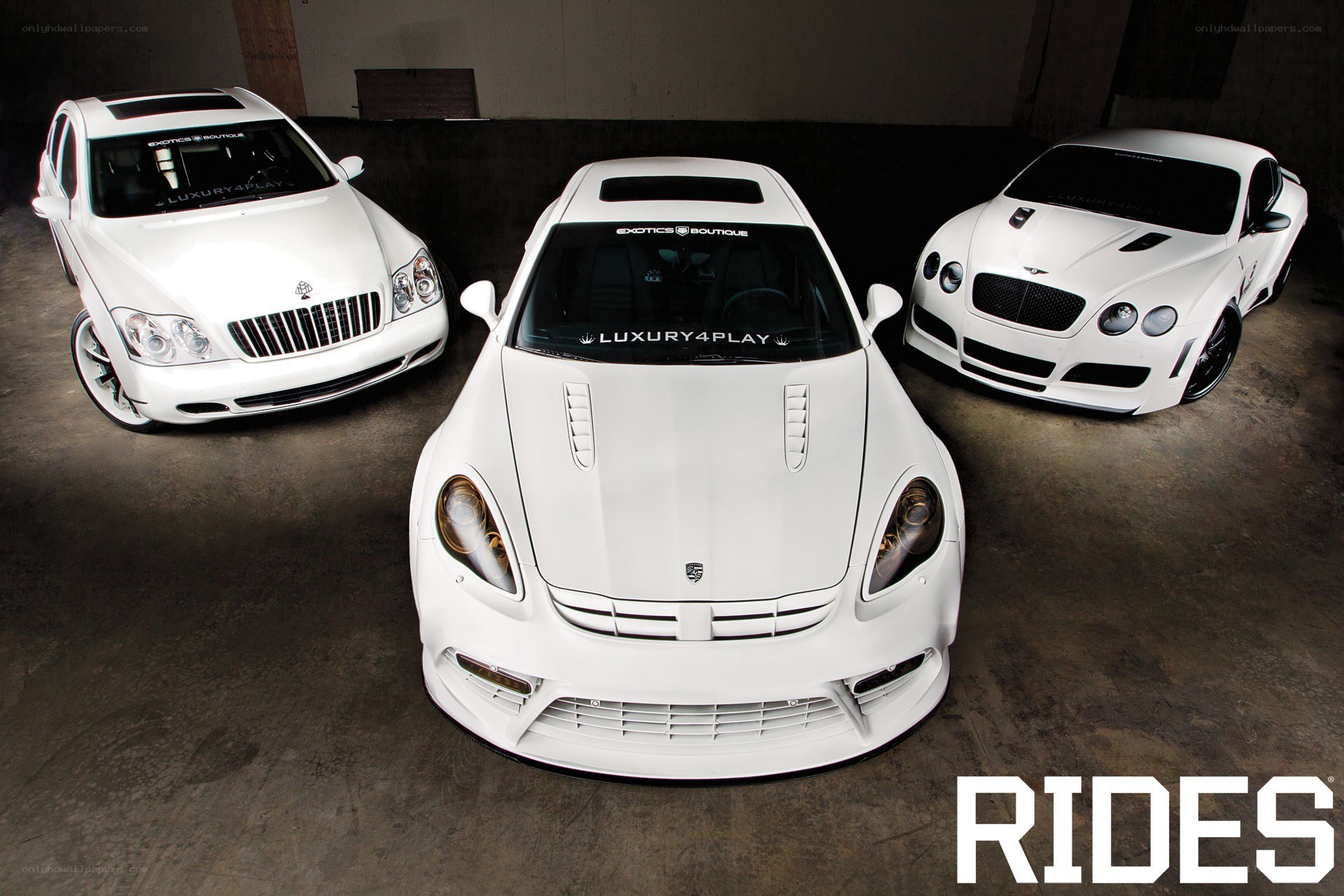 Three white luxury cars