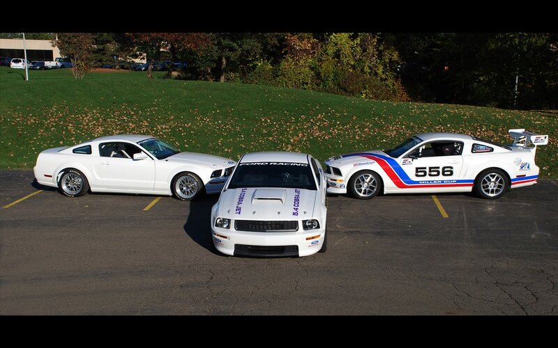 Three White Race Cars
