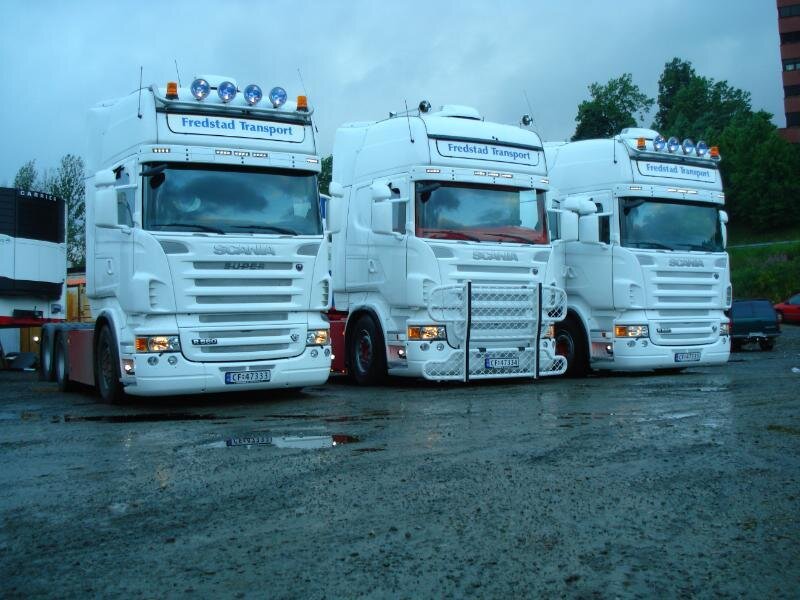 Three White Scania Trucks