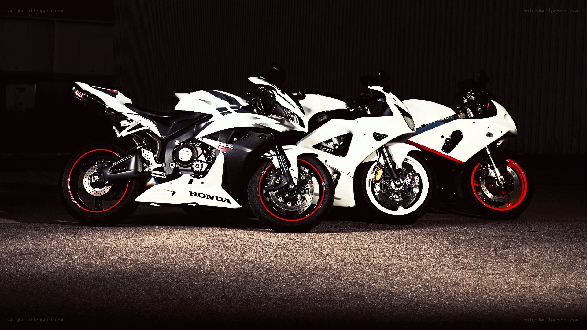 Three white sport motorcycles