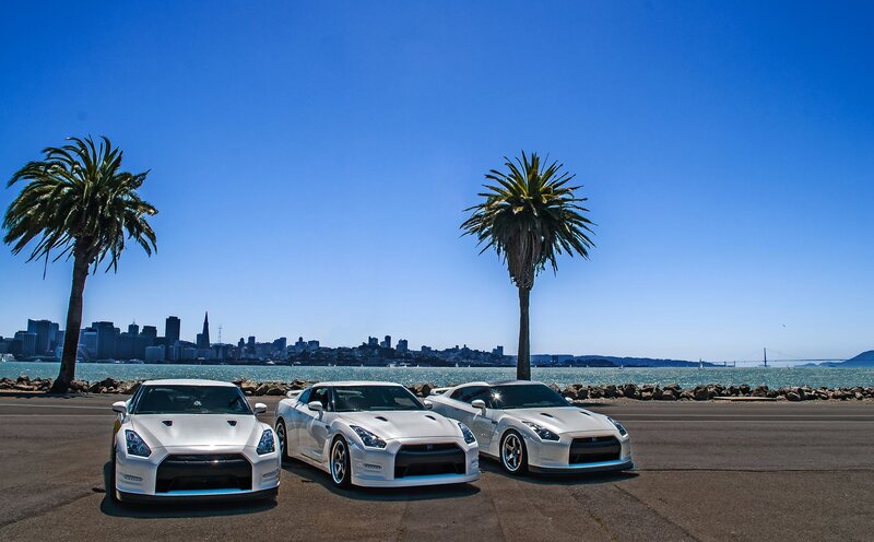 Three White Sports Cars — Blue