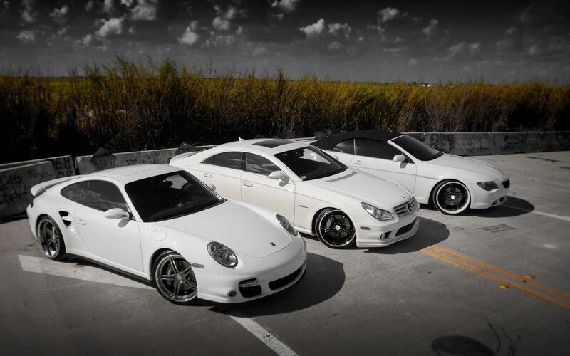 Three White Sports Cars — Dramatic