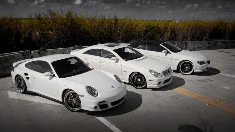 three white sports cars