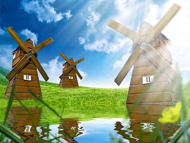 Three Windmills in Field