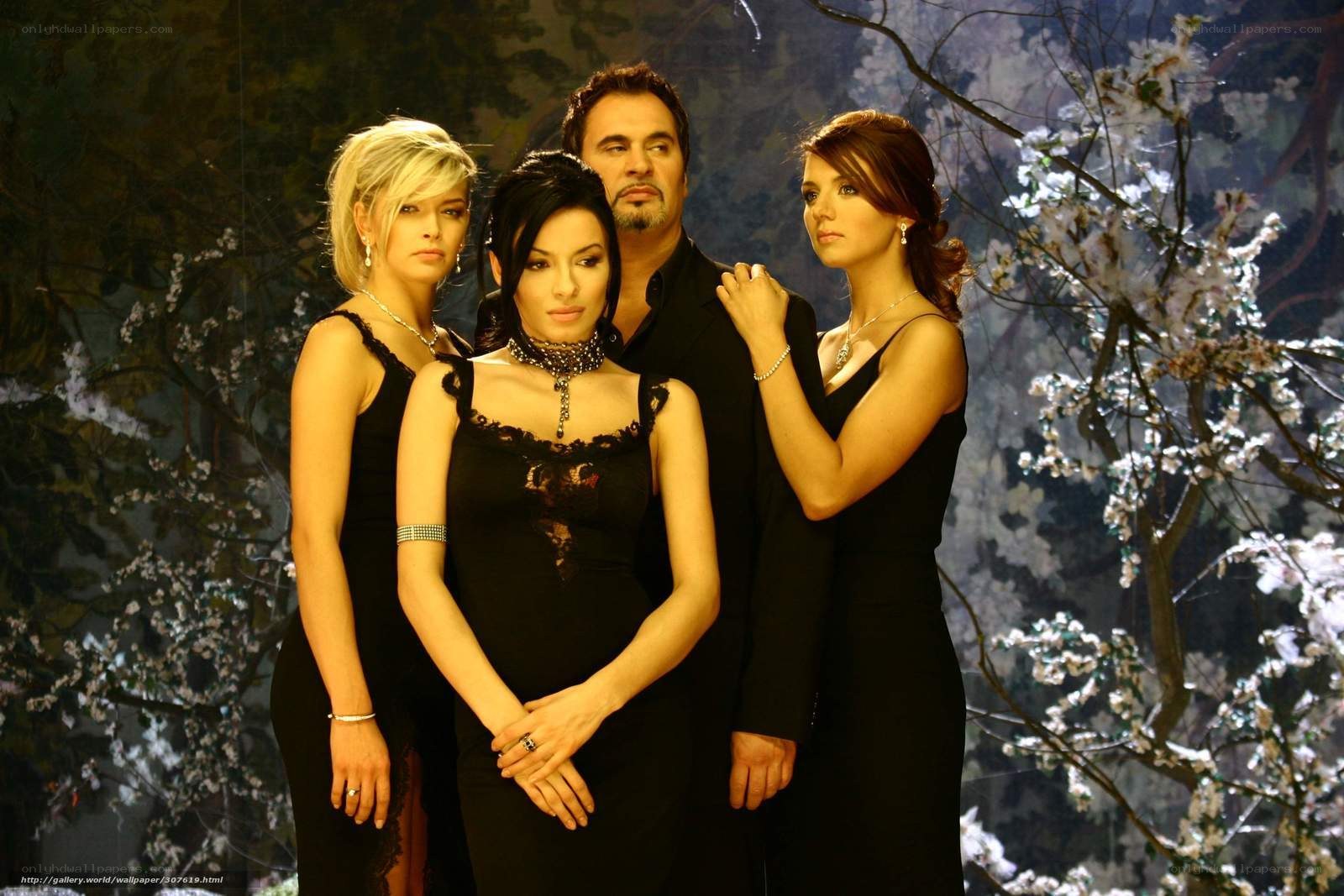 Three women and a man in black