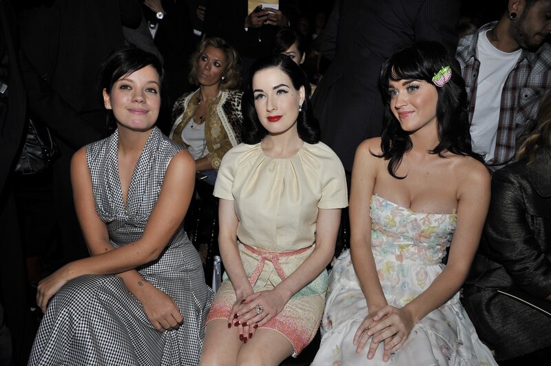Three women at a fashion event