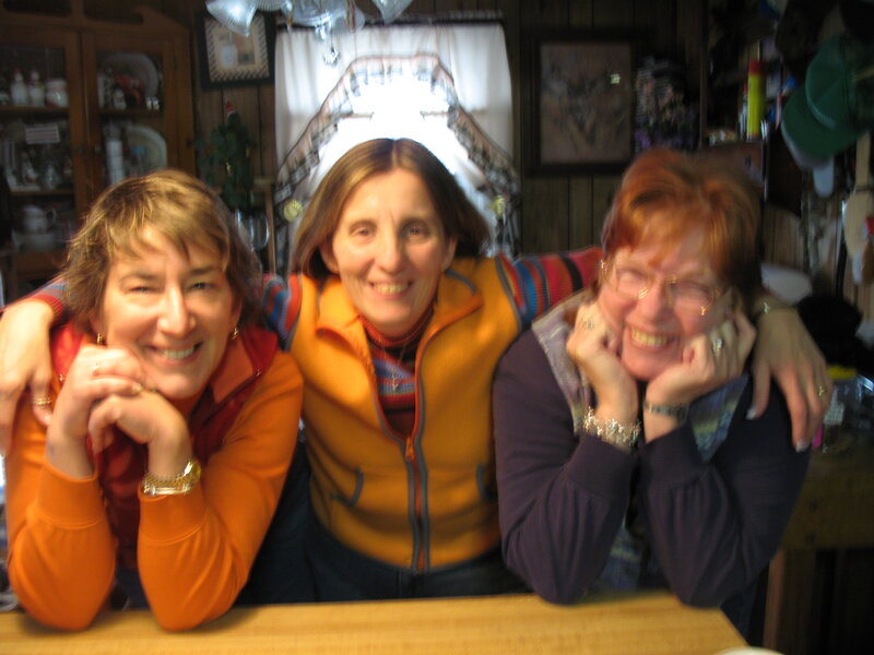 Three Women at Table — Orange