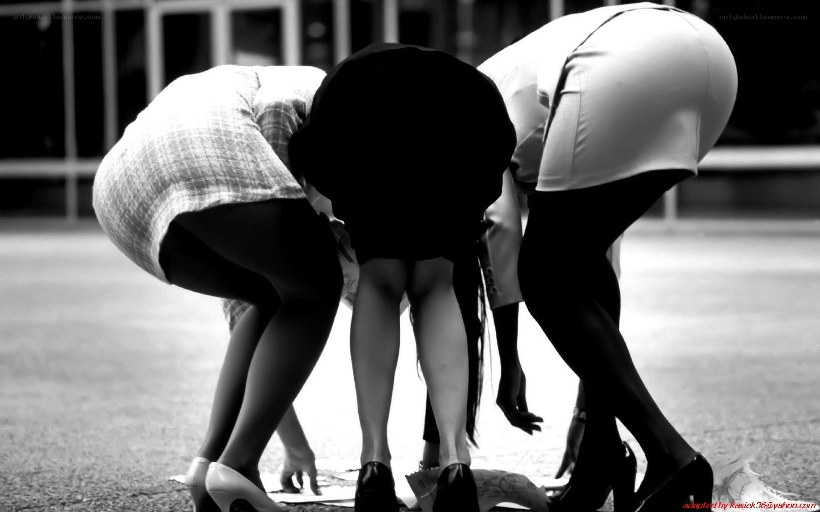 three women bending over