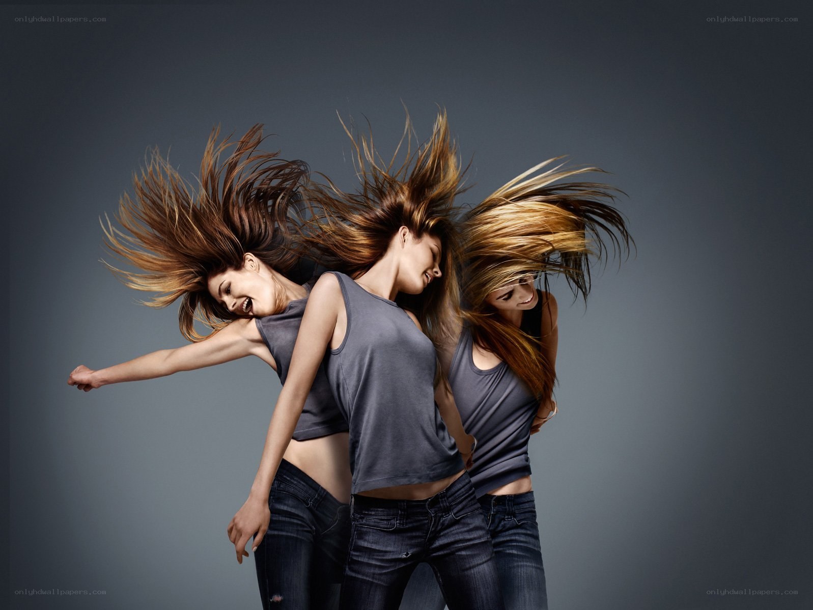 three women dancing in motion