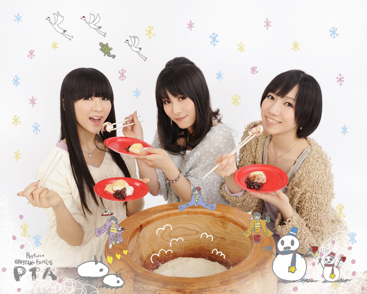 Three women eating mochi