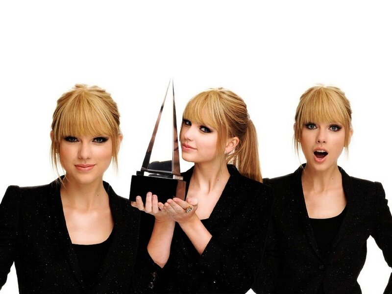 Three Women Holding Award