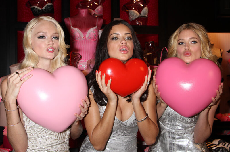 Three Women Holding Hearts