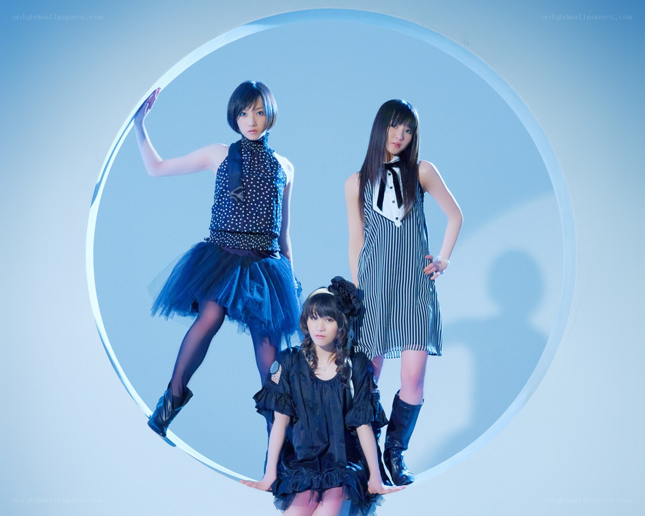 three women in a circular frame