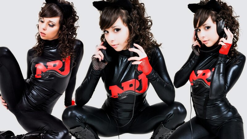 three women in black cat costumes