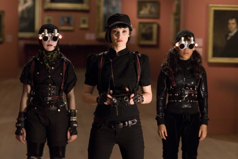 Three women in black outfits