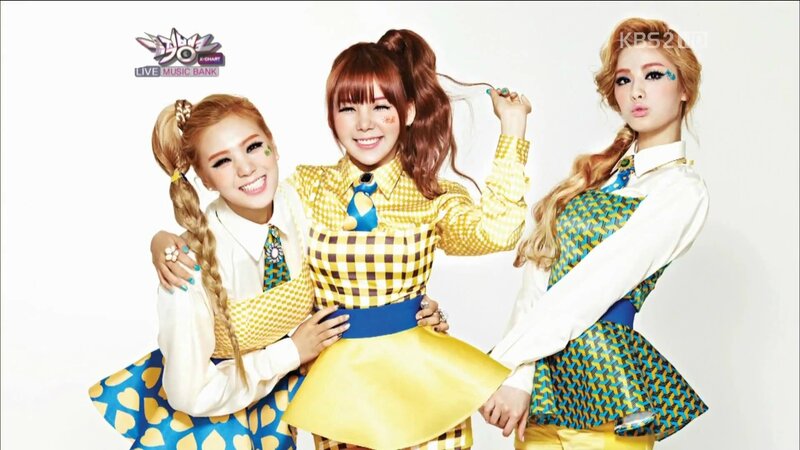 three women in colorful outfits