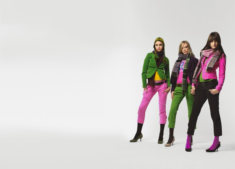three women in colorful outfits