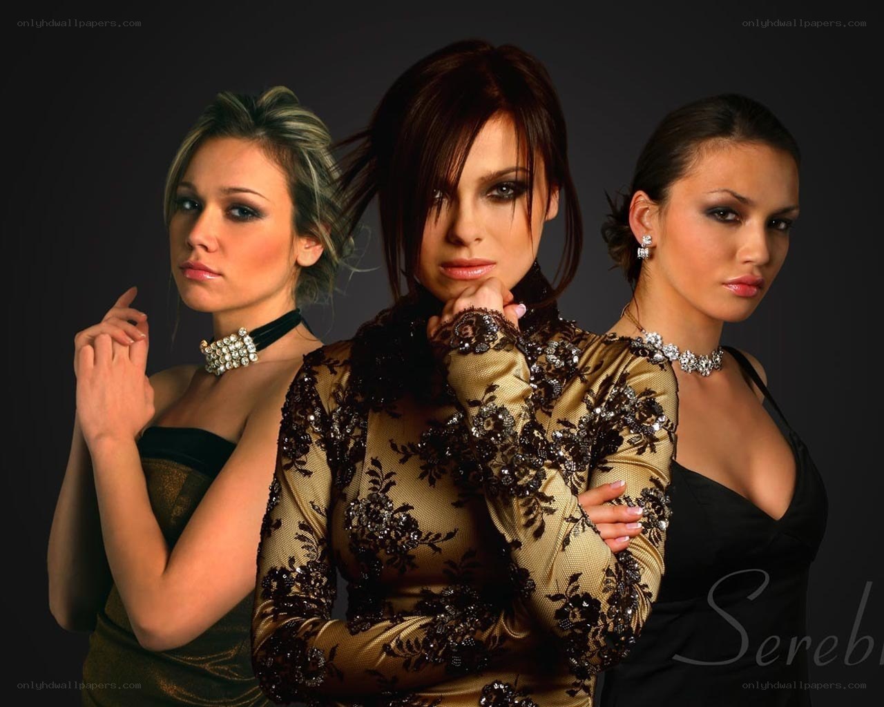 three women in elegant attire