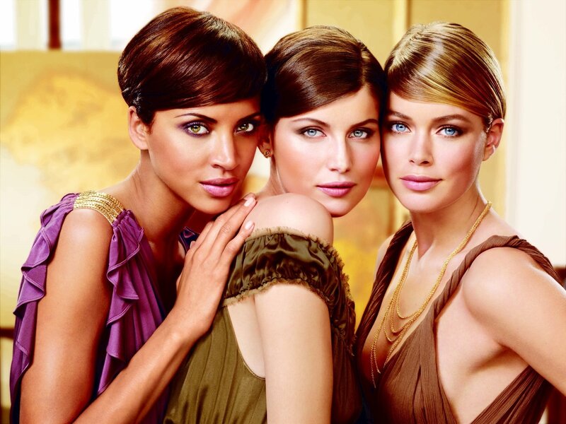 three women in elegant dresses