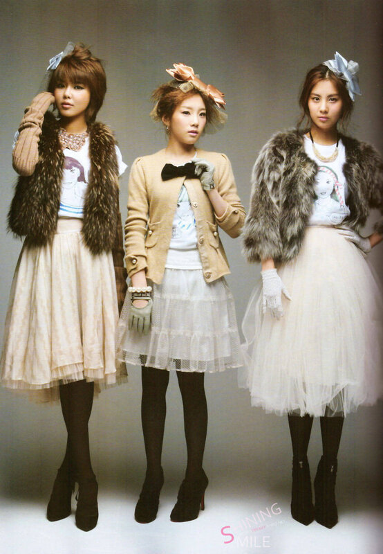 Three women in fashion poses