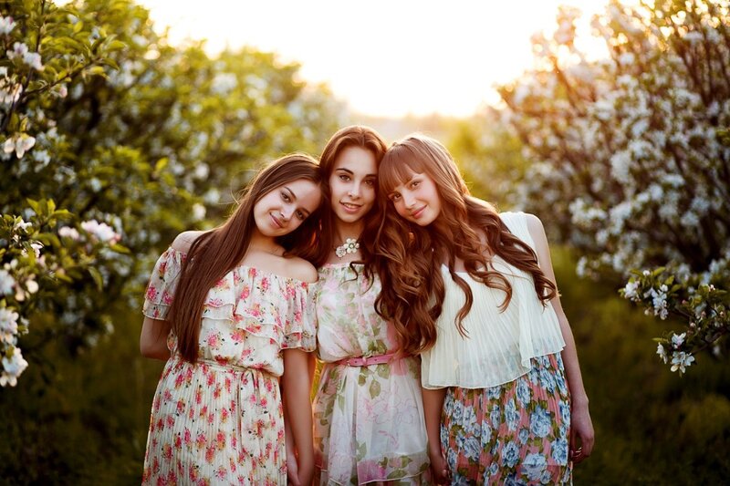 Three Women in Floral Dresses