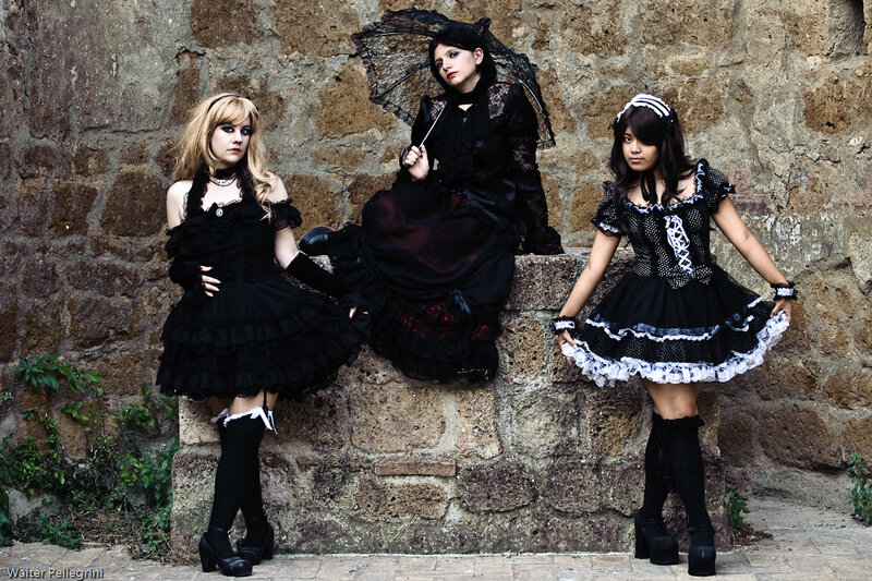 Three women in gothic dresses