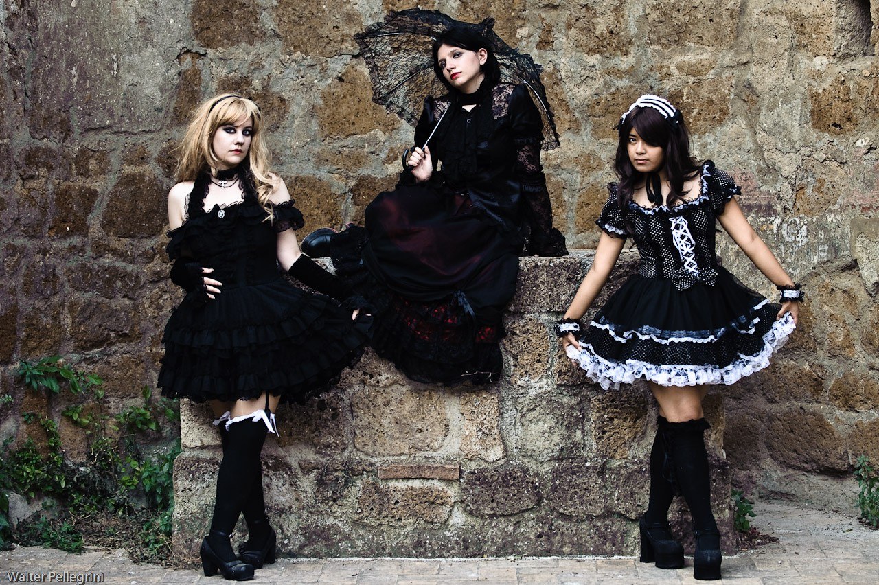 Three women in gothic dresses