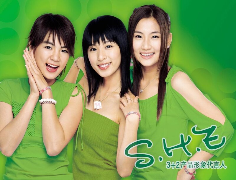 Three Women in Green Shirts