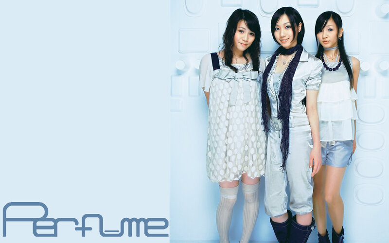three women in light-colored outfits