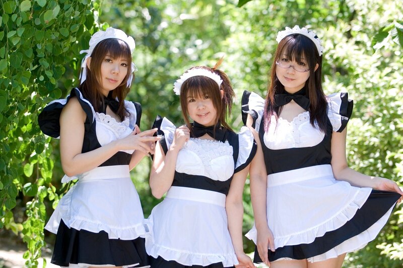 Three women in maid costumes