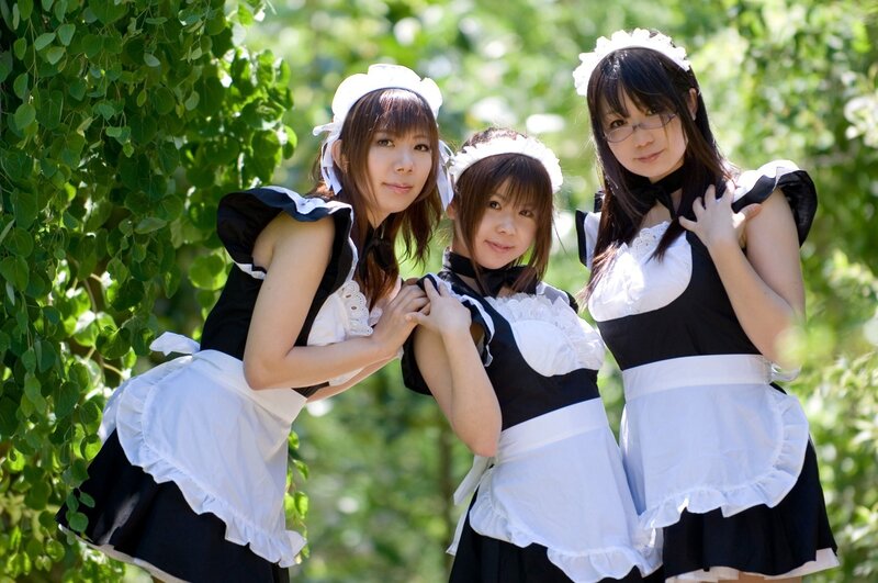 three women in maid costumes