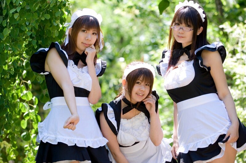 Three women in maid costumes