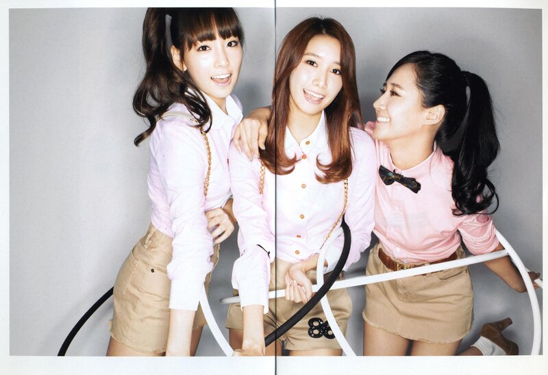 three women in pink shirts